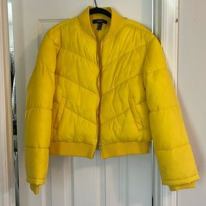 Slightly worn yellow puffer jacket from Forever 21. Size Large but fits small.